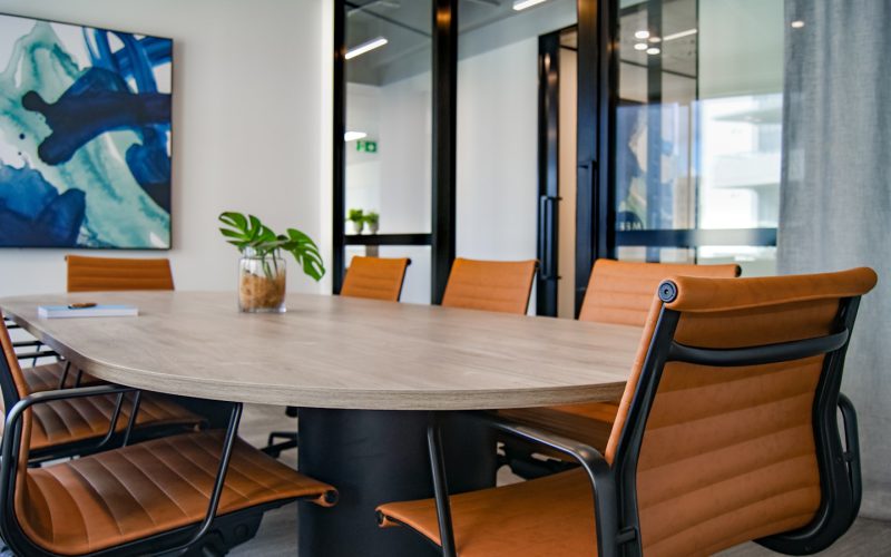 brown wooden 9-piece office table and chairs