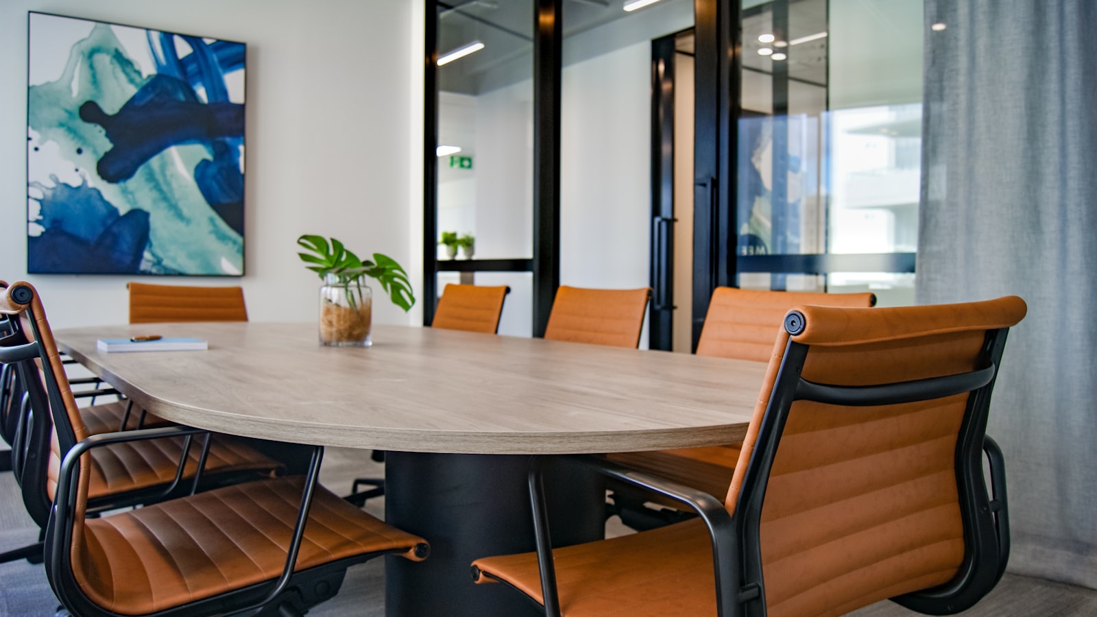 brown wooden 9-piece office table and chairs