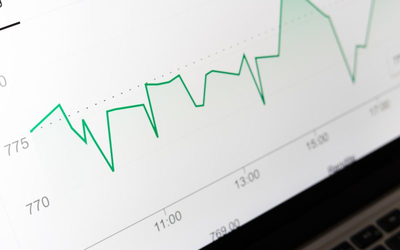 stock market chart displayed on laptop screen