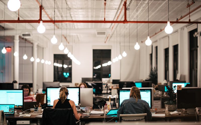 people sitting on chair in front of computer