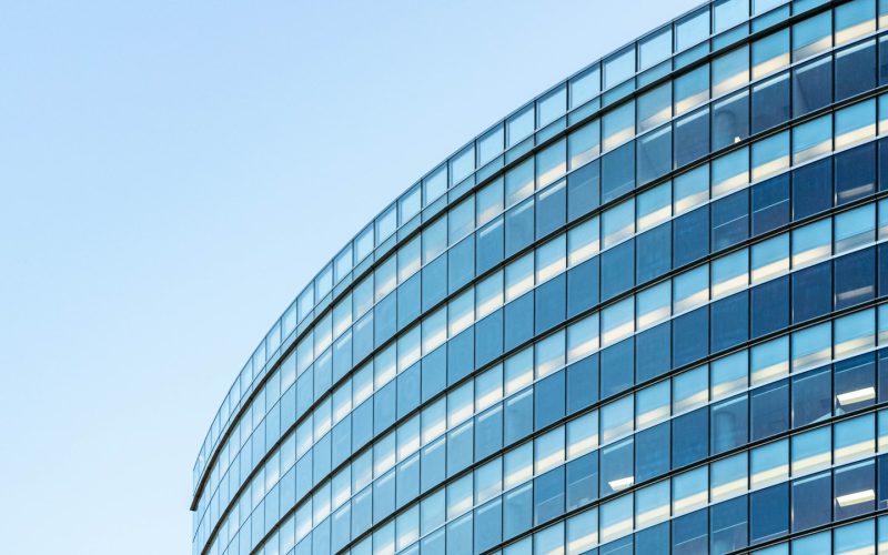 white and blue glass walled building