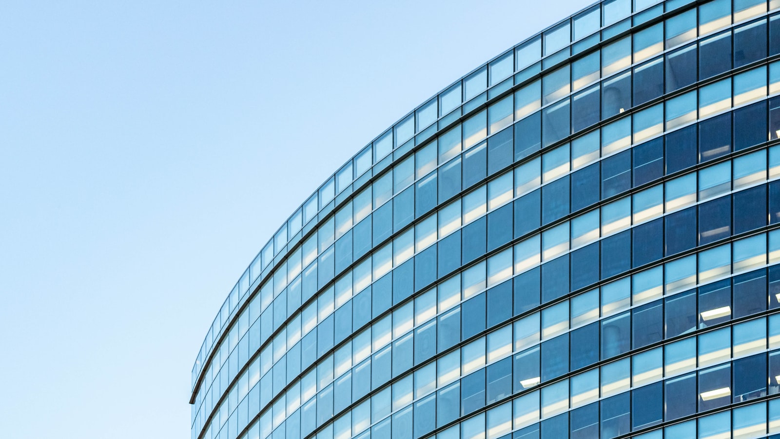 white and blue glass walled building