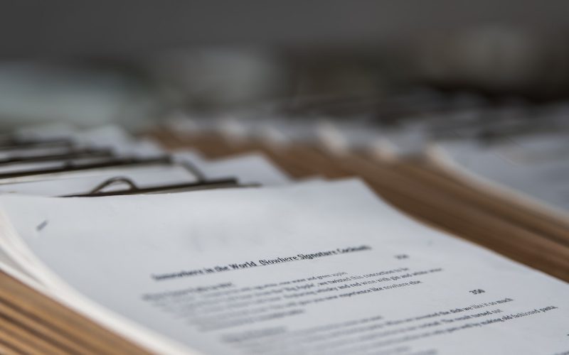 restaurant menus on clipboards close up