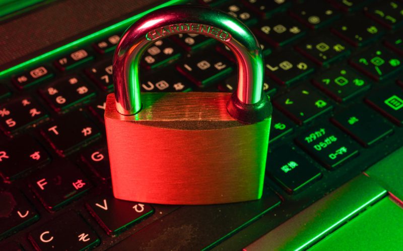 red padlock on black computer keyboard