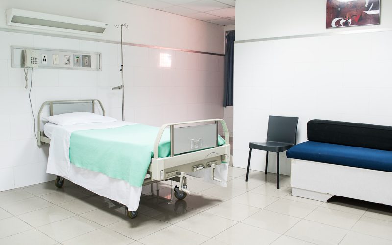 hospital bed near couch