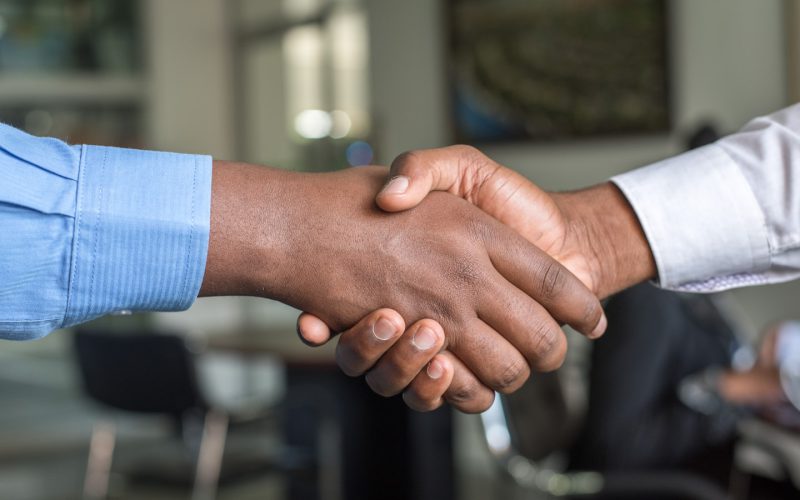 two people shaking hands