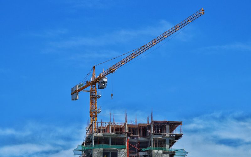 a crane lifting a building