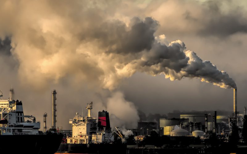 industrial harbor with smokestack pollution
