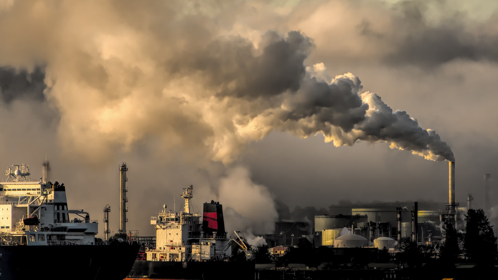 industrial harbor with smokestack pollution